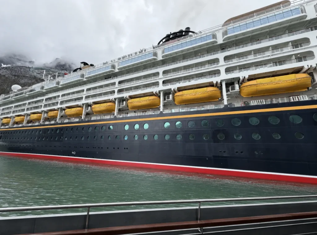 View of the Disney Magic as well pulled away to view the glacier in a small boat.