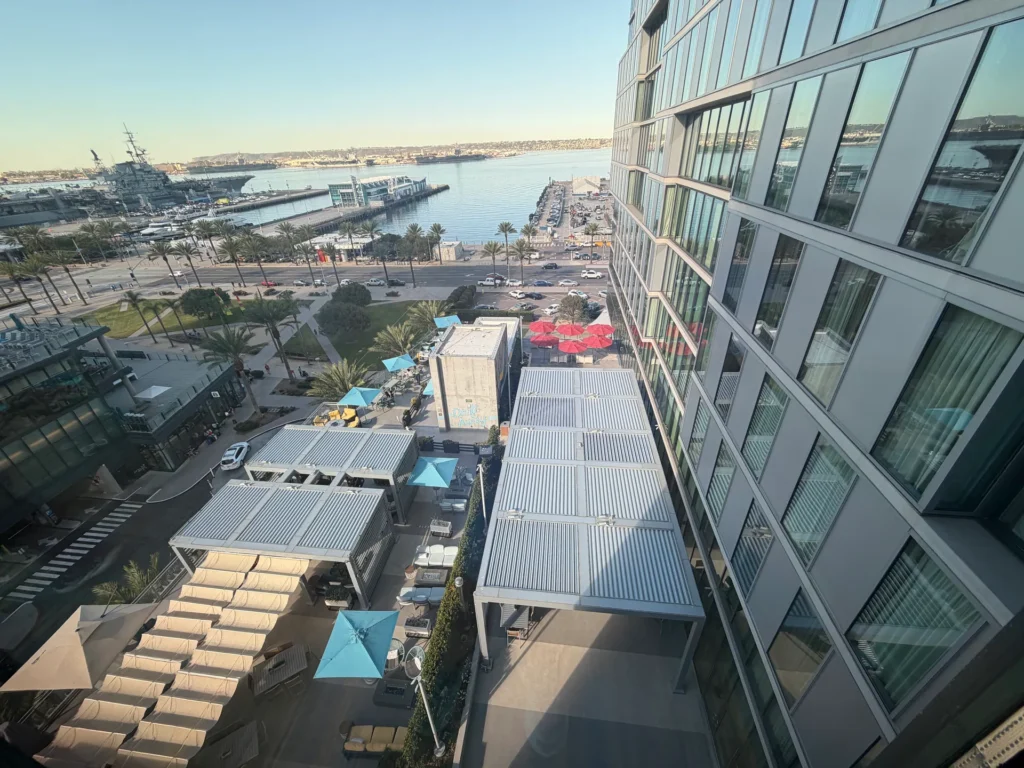 View from SpringHill Suites San Diego over the Harbor & Sky terrace and Harbor Drive to the USS Midway on the bay