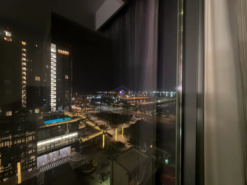 Nighttime view south from our 11th-floor room at SpringHill Suites San Diego, with the USS Midway lit up on the bay
